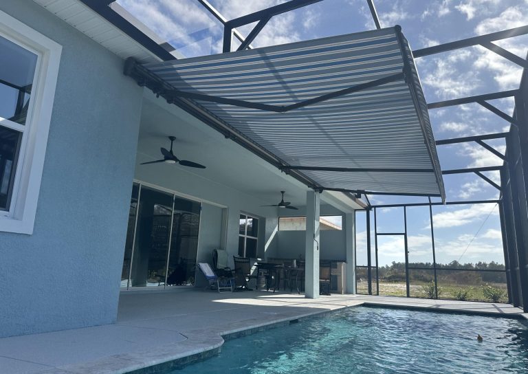 SunPro motorized retractable awning extended over a pool deck in Bradenton Florida providing shade and UV protection